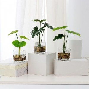 potted artificial plant in Imitation water with glass ware